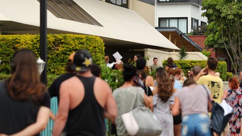 People queue outside Centrelink in Pam Beach on March 23, 2020 in Various Cities, Australia.