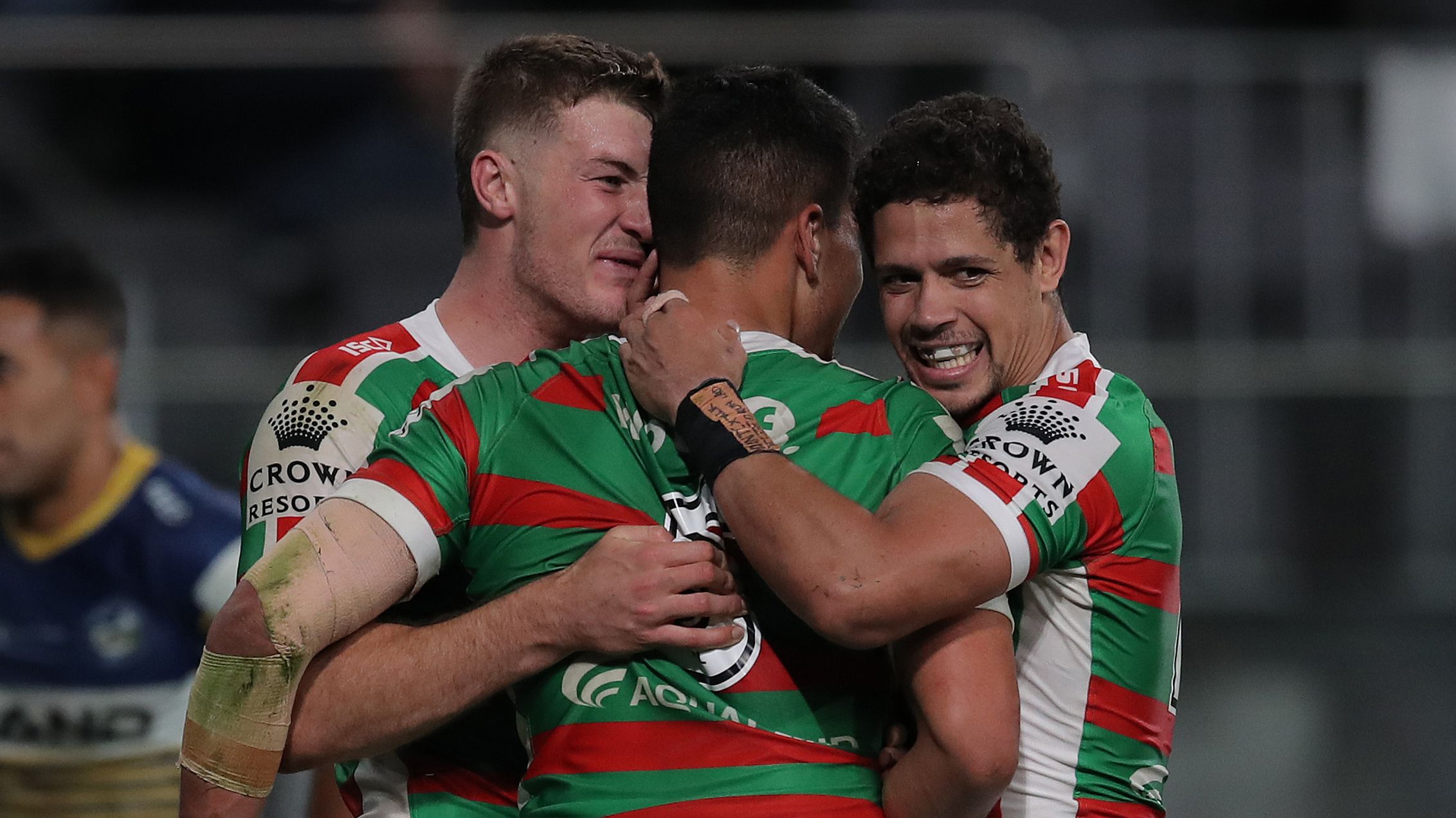 Campbell Graham (left) celebrates a try with Souths teammates.