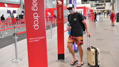 A passenger is seen at the Virgin Australia terminal at the Brisbane Domestic Airport in Brisbane, in March.
