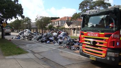Fire and Rescue NSW quench a fire on a garbage truck. (9NEWS)