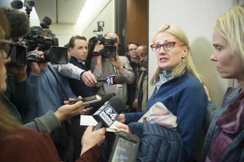 A friend and neighbour of Justine's, Sarah Kuhnen, talks to the media after the announcement of charges. Picture: AAP