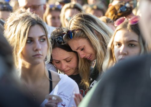 Friends and fellow students struggle to contain their emotions at the vigil in Santa Fe. Picture: AP
