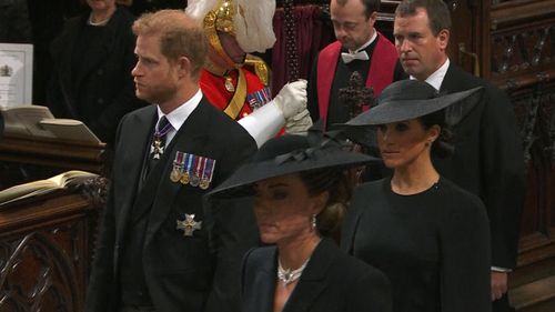 Prince Harry, his wife Meghan Markle and Catherine at the Queen's funeral.