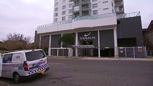 Queensland Police have claimed a man was attempting to run from officers before falling to his death from the 13th floor balcony of an Ipswich unit building yesterday. 