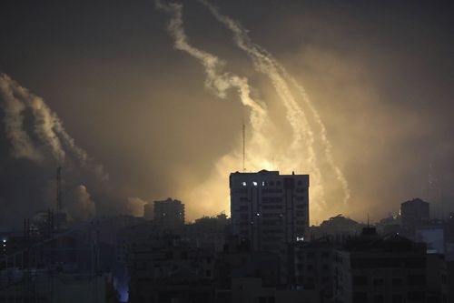 Smoke and explosions caused by Israeli bombardment are seen on the horizon in northern Gaza, Saturday, Oct. 28, 2023.