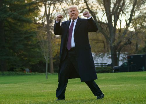 Trump gestures as he walks to Marine One after speaking to media at the White House in Washington.