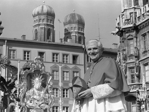 Cardinal Joseph Ratzinger, with the towers of Munich's cathedral in the background, bids farewell to Bavarian believers in downtown Munich, Germany, on February 28, 1982, before heading to Rome to lead the Congregation for the Doctrine of the Faith at the Vatican. Cardinal Ratzinger went on to become Pope Benedict XVI.