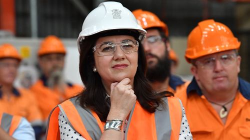 The premier meets factory workers in Maryborough. (AAP)