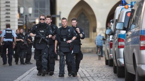 Police officers patrol the area. (DPA)