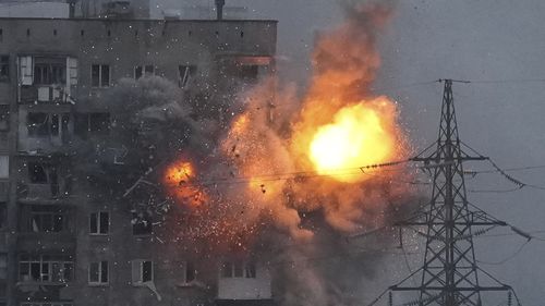 An explosion in an apartment building that came under fire from a Russian army tank in Mariupol, Ukraine, with the city being left without water, gas and electricity among the Russian attack. 