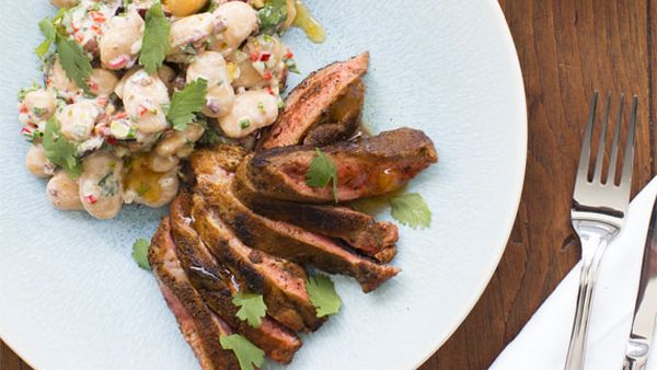 Miguel's butterfly leg of lamb with ras el haout and white bean salad