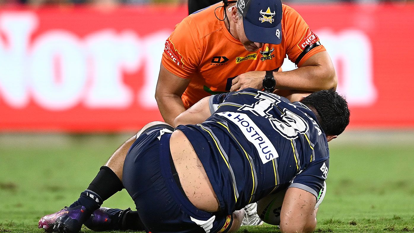  Jason Taumalolo of the Cowboys lays on the ground after being injured