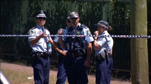 A police officer was doused with petrol at the scene. (9NEWS)