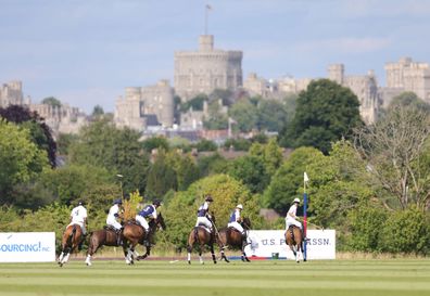 Prince William, Duke of Cambridge (C) rides during the Royal Charity Polo Cup 2022 at Guards Polo Club  during the Outsourcing Inc. Royal Polo Cup at Guards Polo Club, Flemish Farm on July 06, 2022 in Windsor, England