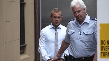Kieran Loveridge (left) wearing handcuffs is escorted from the NSW Supreme Court in 2013.