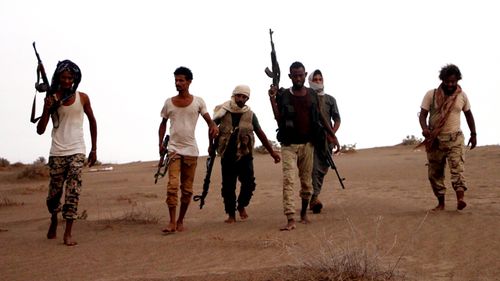 Soldiers of Yemeni government army backed by the Saudi-led coalition take position during military operations on Houthi positions in the port province of Hodeidah, Yemen. (AAP)