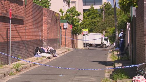 A man has been charged after the bodies of two men were located in Redfern on the weekend.