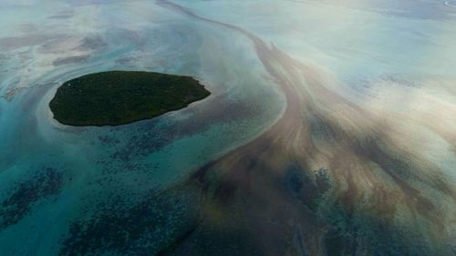 This photo provided by the Mauritian Wildlife Foundation Ministry shows oil leaking from the MV Wakashio, a bulk carrier ship that recently ran aground off the southeast coast of Mauritius, Monday Aug. 10, 2020