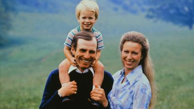 Princess Royal Princess Anne with husband, Mark Phillips carries their son, Peter, on his shoulder in July 1980