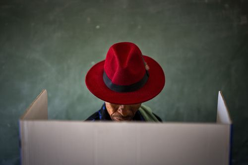 A voter fills out a ballot paper during general elections in Nkandla, Kwazulu Natal, South Africa, Wednesday May 29, 2024.