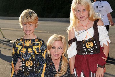 Camille Grammer with daughter Mason and son Jude, on their way to a Halloween party.