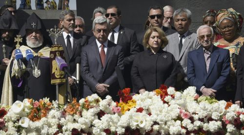 George Clooney, Armenian President Serzh Sarkisian, his wife Rita Sarkisian and French and Armenian singer Charles Aznavour at the ceremony. (AFP)