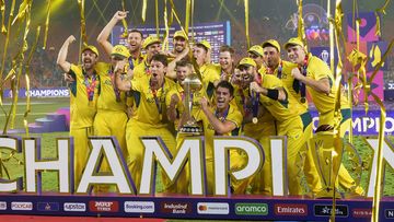 Australia players celebrate with the trophy after Australia won the ICC Men&#x27;s Cricket World Cup final match against India in Ahmedabad, India, Sunday, Nov. 19, 2023. (AP Photo/Rafiq Maqbool)
