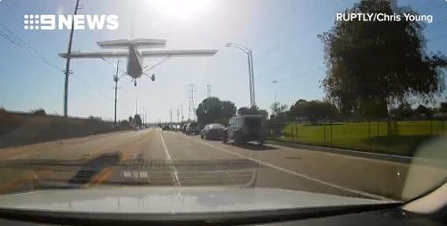 A light plane in California was forced to make an emergency landing on a residential street, to the terror of watching drivers. Picture: Supplied. 