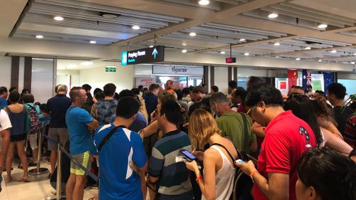 Lines snake around Denpasar Airport. (Supplied/Mary Jordan)