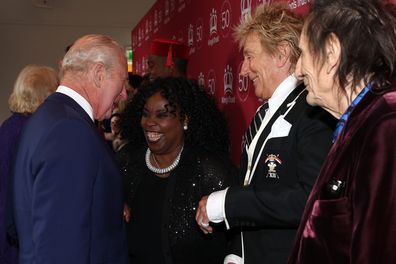 LONDON, ENGLAND - MAY 11: Britain's King Charles III shares a joke with British Jamaican singer Ruby Turner and British rock legends Rod Stewart and Ronnie Wood as he arrives to attend 'A King's Trust 50th Anniversary Celebration' at the Royal Albert Hall on May 11, 2026 in London, England. (Photo by Adrian Dennis – WPA Pool/Getty Images)