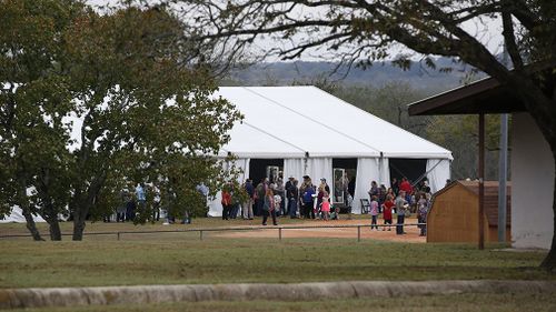 The service was moved outside after it was discovered hundreds of people wanted to attend. (AAP)