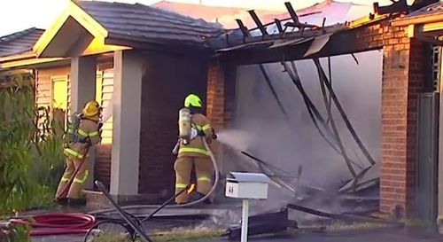 Emergency services rushed to control the fire, which gutted the home's garage and caused significant damage to the structure.