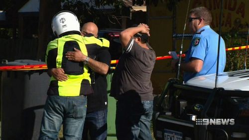 Family members are comforted by one another. Picture: 9NEWS