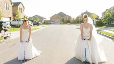 Jaime Sladek from Georgetown, Texas pose in their wedding dresses for fun social distancing photoshoot by neighbour Elyssa Seibel