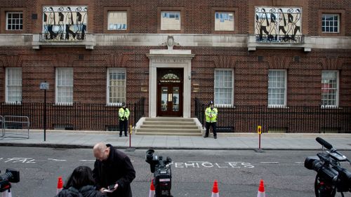 Guards outside the Lindo Wing at St. Mary's Hospital in London shortly after Duchess Kate arrived. (AAP)