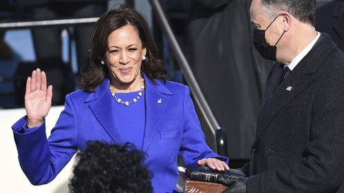 Kamala Harris is sworn in as vice president by Supreme Court Justice Sonia Sotomayor as her husband Doug Emhoff holds the Bible during the 59th Presidential Inauguration at the U.S. Capitol in Washington, Wednesday, Jan. 20, 2021.