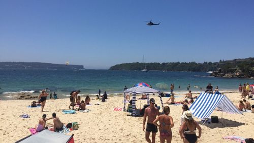 Three people have been rescued after a boat capsized in Balmoral Bay.