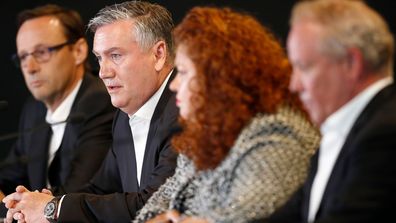 Eddie McGuire addresses the media alongside other Collingwood leaders.