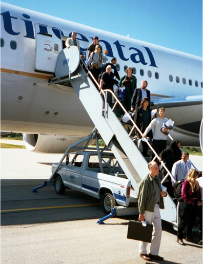 September 11, 2001: Nick Marson took this photo of the passengers finally disembarking Continental 5 in Gander, Canada.