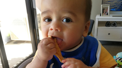 Baby Izaha enjoying some solid food