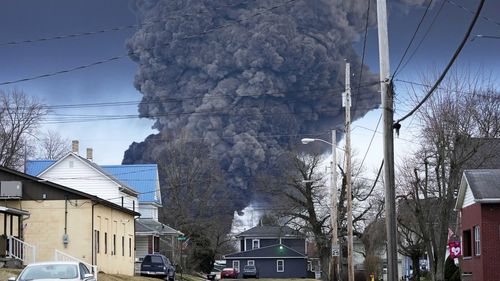 FILE - A black plume rises over East Palestine, Ohio, as a result of a controlled detonation of a portion of the derailed Norfolk Southern trains, Feb. 6, 2023. West Virginia's water utility says it's taking precautionary steps following the derailment of a train hauling chemicals that later sent up a toxic plume in Ohio. The utility said in a statement on Sunday, Feb. 16, 2023 that it has enhanced its treatment processes even though there hasnt been a change in raw water at its Ohio River intak