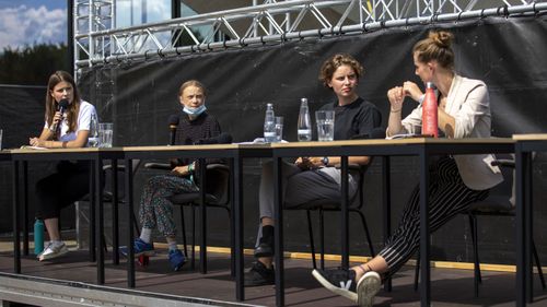 German climate activist Luisa Neubauer (L-R), Swedish climate activist Greta Thunberg, Belgian climate activist Anuna De Wever and Belgian climate activist Adelaide Charlier attend a press conference following the meeting with German Chancellor Angela Merkel on August 20, 2020 in Berlin, Germany