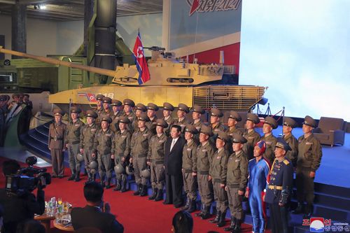 Kim Jong Un reviewed the rare exhibition and vowed to build an "invincible" military, as he accused the United States of creating regional tensions.