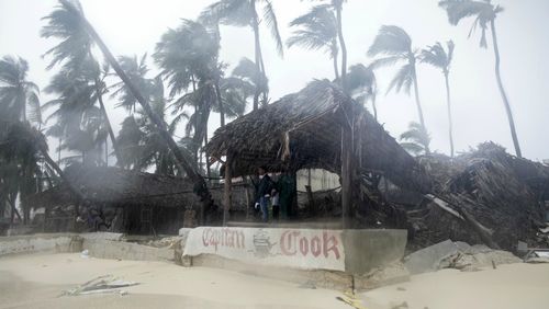 A person looks out from the Captain Cook restaurant damaged during the crossing of Hurricane Maria, on Cofrecito Beach, in Bavaro, Dominican Republic.