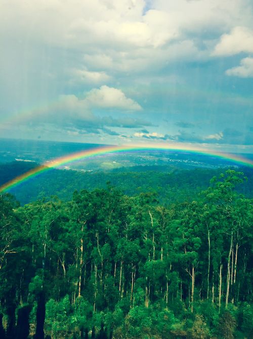 A stunning rainbow in Wongawallan, Queensland, following light showers this afternoon. (Supplied/ Julie Andersen)