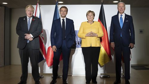 From left: British Prime Minister Boris Johnson, French President Emmanuel Macron, German Chancellor Angela Merkel and U.S. President Joe Biden at the G20 summit in Rome. 