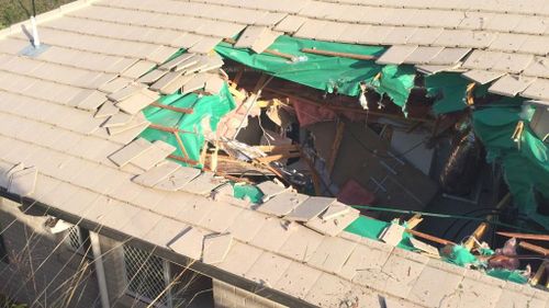 A car has ploughed through the roof of a home northwest of Brisbane. (9NEWS)