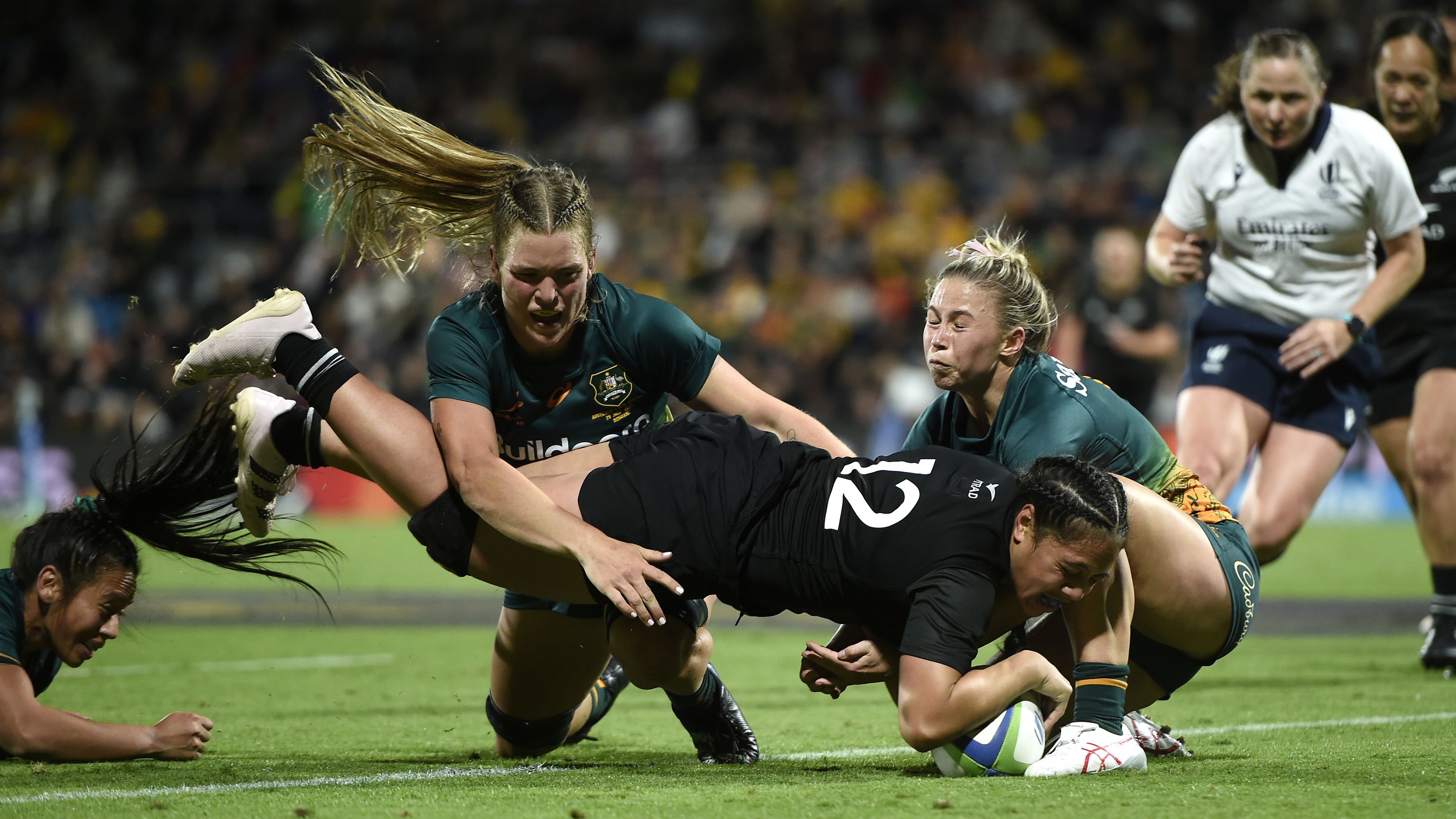 Sylvia Brunt of New Zealand scores a try in Brisbane.