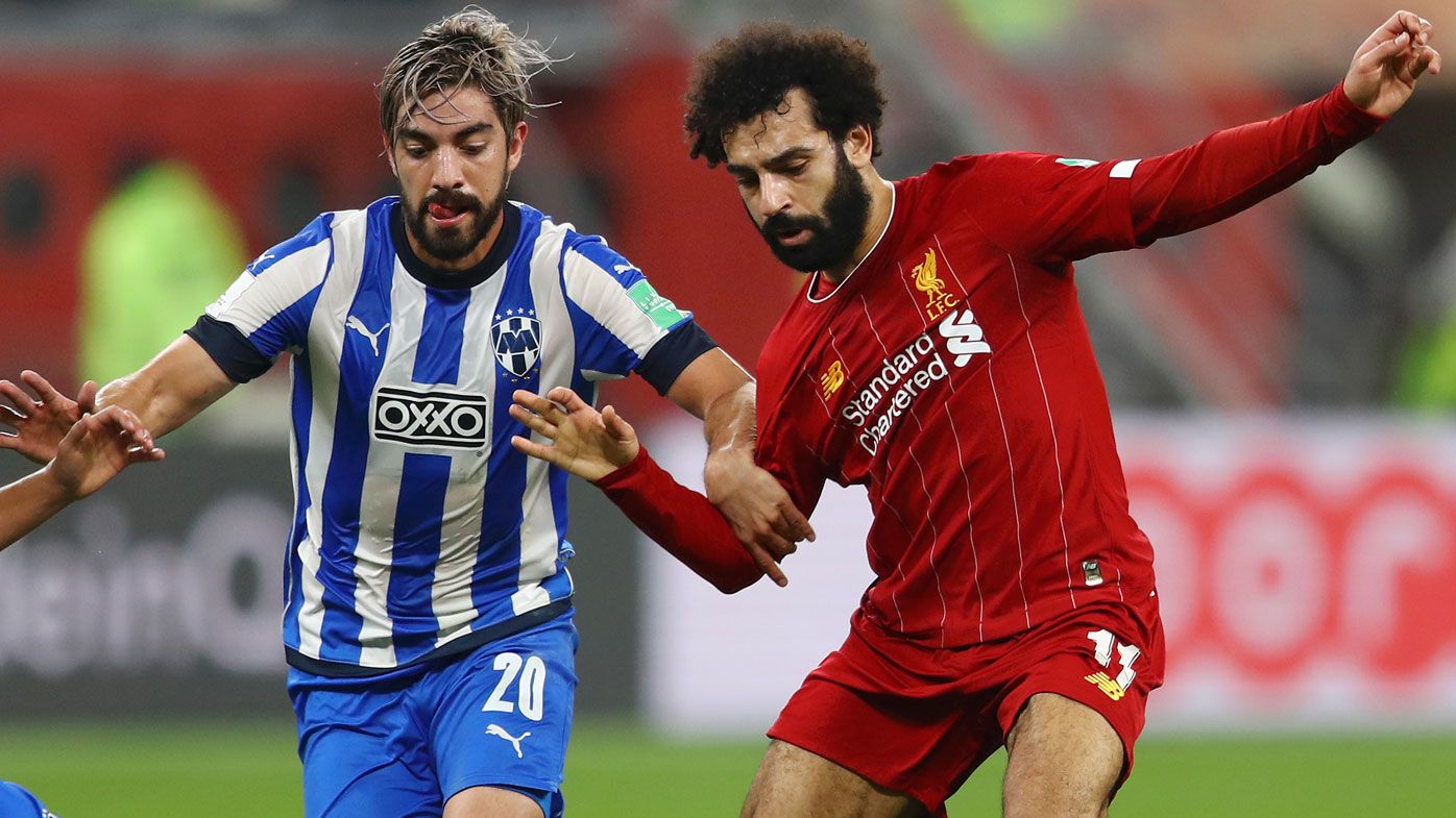 Mohamed Salah of Liverpool battles for possession with Carlos Rodriguez and Rodolfo Pizarro of C.F. Monterrey during the FIFA Club World Cup semi-final 