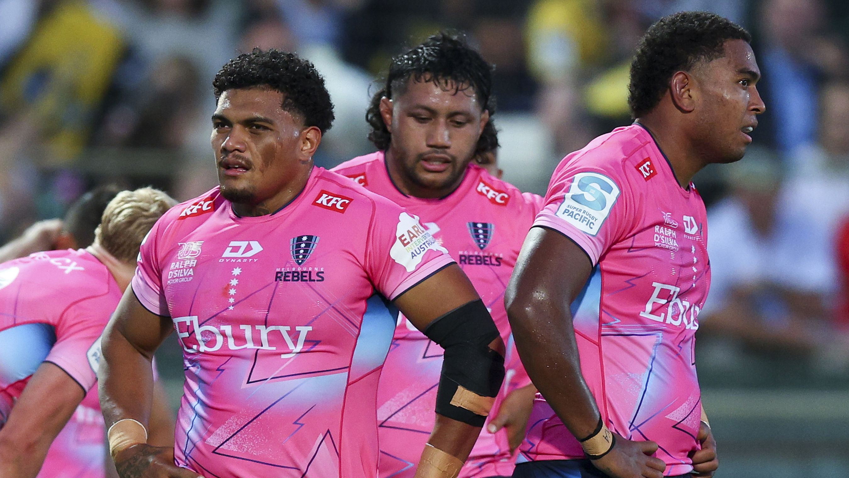Rebels players look on in disappointment during the round five Super Rugby Pacific match against the Hurricanes.